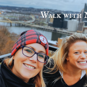 Meghan Snatchko and a smiling friend overlooking the Pittsburgh skyline and rivers on a crisp autumn day, promoting Walk With Meghan private walking tours by GetLostPGH.